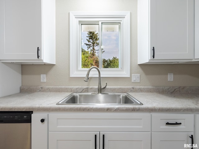 2922 W Larchmont Ln, Peoria, IL 61615 - kitchen with dishwasher, white cabinetry, and light countertops
