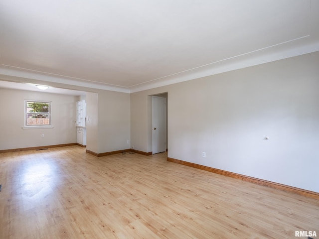1505 N 9th St, Pekin, IL 61554 - spare room featuring light wood finished floors and baseboards