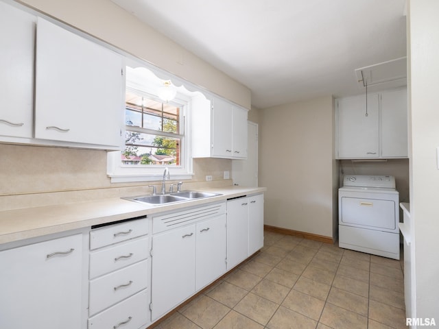 1505 N 9th St, Pekin, IL 61554 - kitchen with washer / dryer, light countertops, white cabinets, and light tile patterned floors