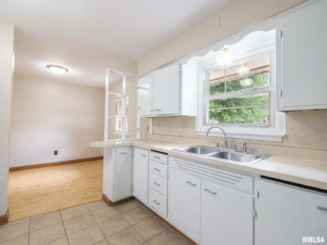1505 N 9th St, Pekin, IL 61554 - kitchen with light countertops, white cabinets, light tile patterned floors, and backsplash