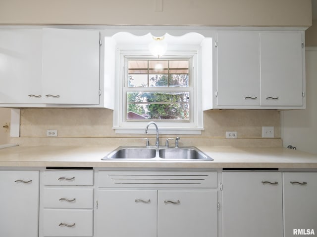 1505 N 9th St, Pekin, IL 61554 - kitchen featuring light countertops, white cabinetry, and backsplash