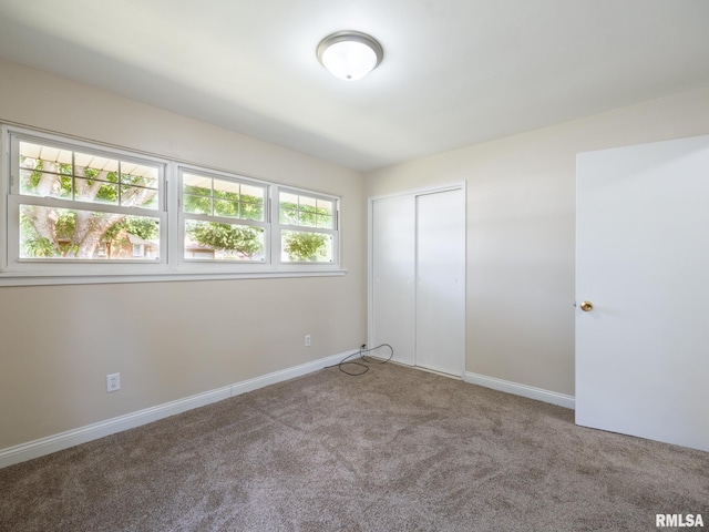1505 N 9th St, Pekin, IL 61554 - unfurnished bedroom with carpet floors and a closet