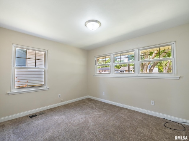 1505 N 9th St, Pekin, IL 61554 - empty room featuring carpet floors and baseboards