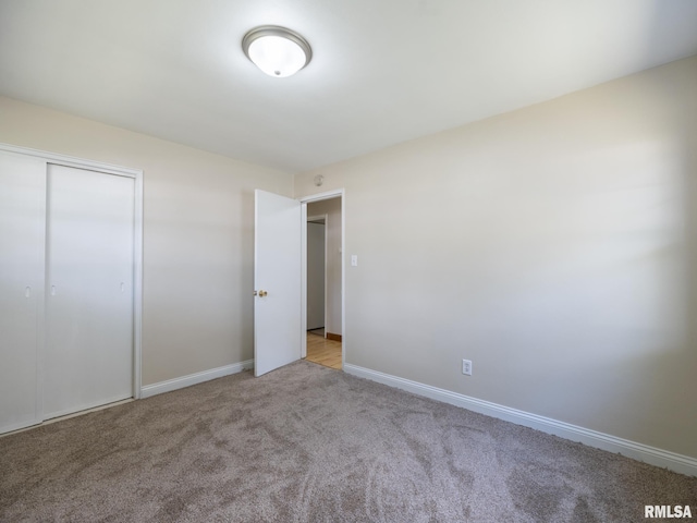 1505 N 9th St, Pekin, IL 61554 - unfurnished bedroom featuring carpet flooring and a closet