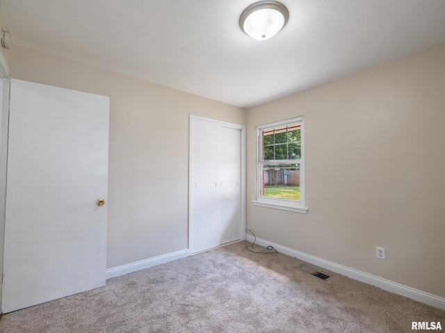 1505 N 9th St, Pekin, IL 61554 - unfurnished bedroom with carpet floors and a closet