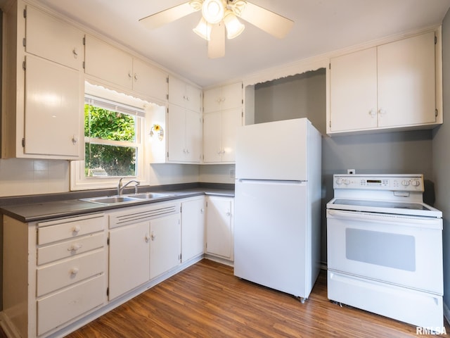 3 Starcevich Ct, Pekin, IL 61554 - kitchen with white appliances, dark countertops, dark wood-style floors, ceiling fan, and tasteful backsplash
