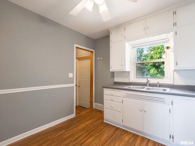 3 Starcevich Ct, Pekin, IL 61554 - kitchen with ceiling fan, wood finished floors, white cabinetry, and dark countertops