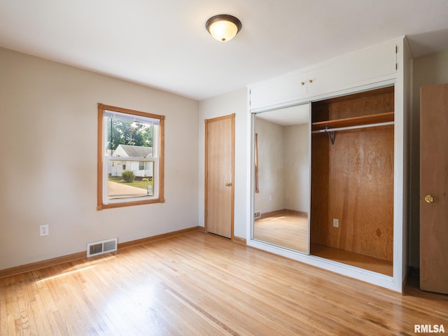 3 Starcevich Ct, Pekin, IL 61554 - unfurnished bedroom with light wood-style flooring and a closet