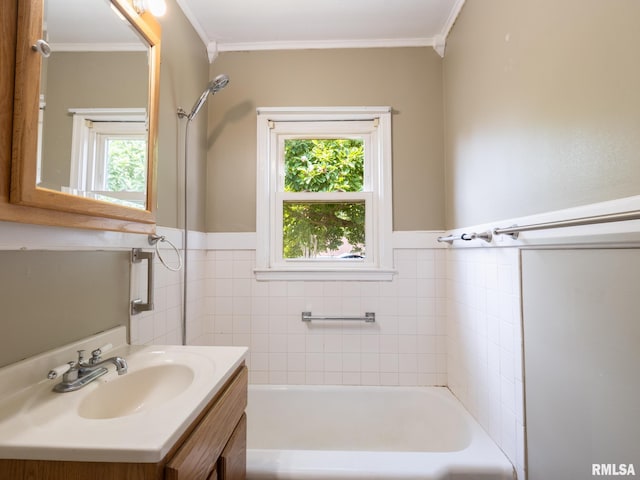 3 Starcevich Ct, Pekin, IL 61554 - bathroom featuring plenty of natural light, a bath, vanity, a wainscoted wall, and ornamental molding