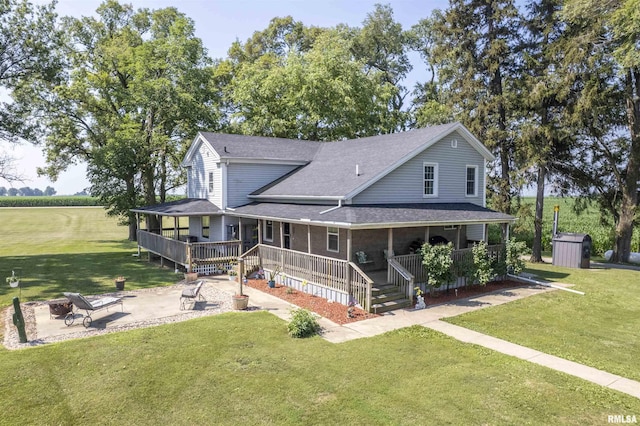 8373 State Route 93rd Rd, Toulon, IL 61483 - back of house with a porch, a shed, a yard, a patio, and a shingled roof