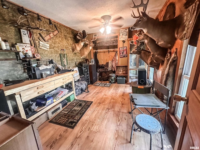 8373 State Route 93rd Rd, Toulon, IL 61483 - interior space with wood finished floors, a textured ceiling, and a ceiling fan
