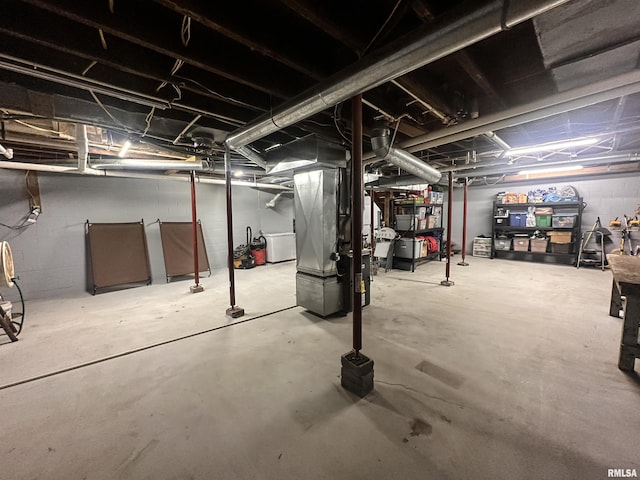 8373 State Route 93rd Rd, Toulon, IL 61483 - unfinished below grade area with heating unit and washer / clothes dryer