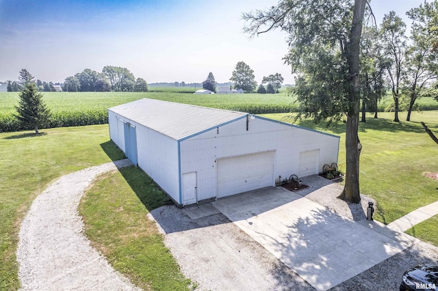 8373 State Route 93rd Rd, Toulon, IL 61483 - detached garage featuring agricultural plots, a view of countryside, and concrete driveway