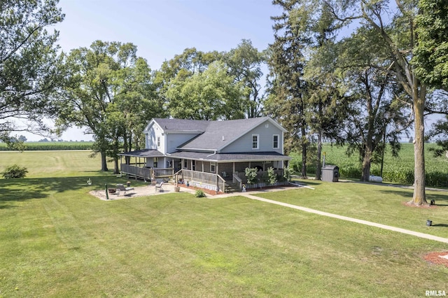 8373 State Route 93rd Rd, Toulon, IL 61483 - rear view of property featuring a storage unit, a lawn, and a porch
