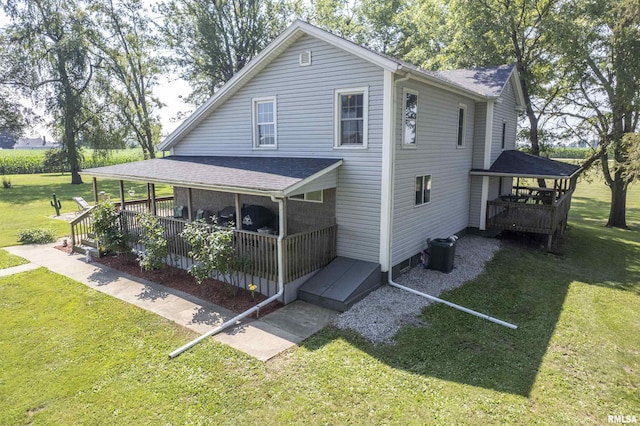 8373 State Route 93rd Rd, Toulon, IL 61483 - view of front of home with a front yard and a wooden deck