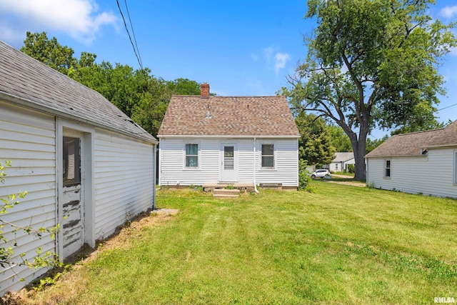 2046 W Wilson Ave, Peoria, IL 61604 - back of property with a chimney and a lawn
