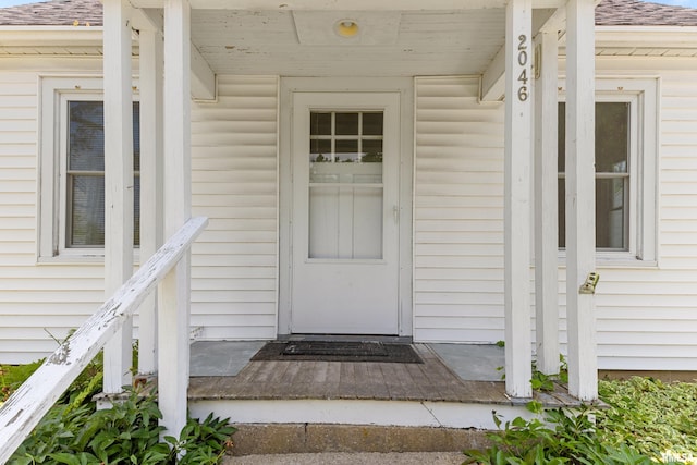 2046 W Wilson Ave, Peoria, IL 61604 - view of exterior entry featuring roof with shingles and covered porch