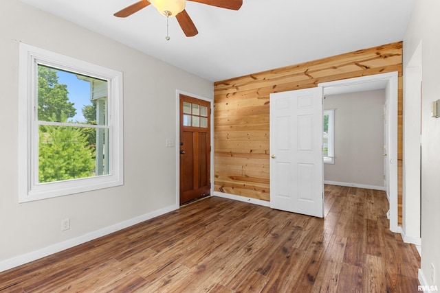 2046 W Wilson Ave, Peoria, IL 61604 - foyer featuring plenty of natural light, wood walls, wood finished floors, and a ceiling fan