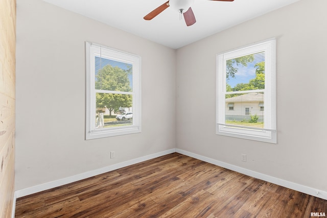 2046 W Wilson Ave, Peoria, IL 61604 - unfurnished room featuring plenty of natural light, wood finished floors, and a ceiling fan