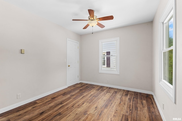 2046 W Wilson Ave, Peoria, IL 61604 - unfurnished room with plenty of natural light, dark wood-type flooring, and ceiling fan