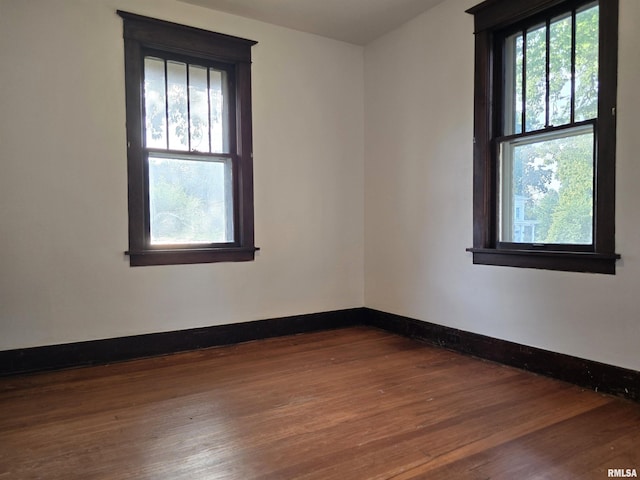 1113 S 5th St, Pekin, IL 61554 - unfurnished room with dark wood-type flooring and baseboards