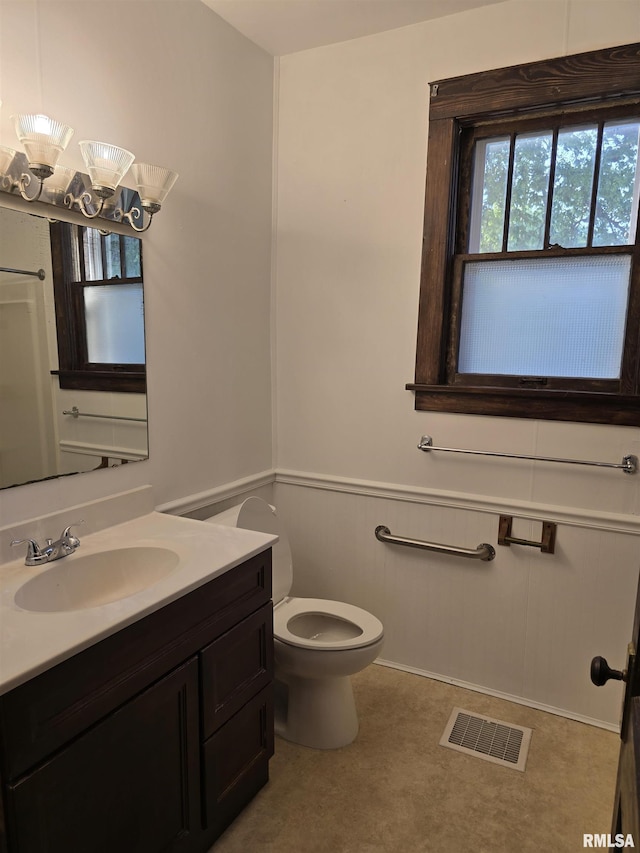 1113 S 5th St, Pekin, IL 61554 - bathroom with vanity and a wainscoted wall