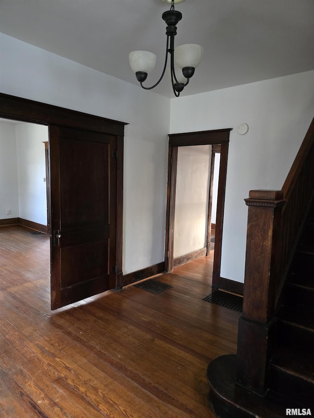 1113 S 5th St, Pekin, IL 61554 - unfurnished dining area featuring dark wood-type flooring and a chandelier