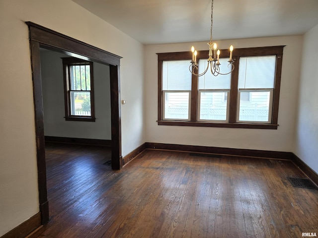 1113 S 5th St, Pekin, IL 61554 - spare room featuring a chandelier and dark wood-type flooring