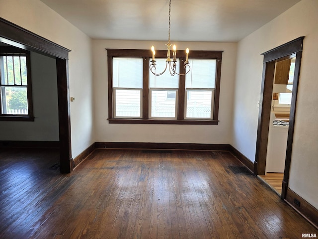 1113 S 5th St, Pekin, IL 61554 - unfurnished dining area featuring a chandelier, dark wood-style floors, and healthy amount of natural light