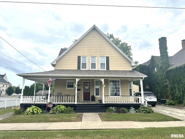 146 W Locust St, Canton, IL 61520 - view of front facade with covered porch and roof with shingles