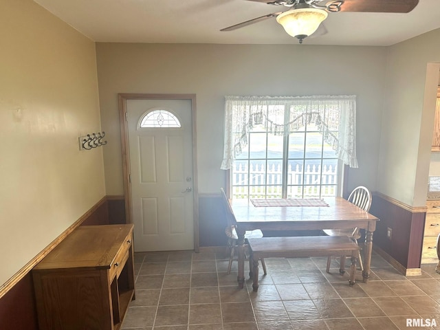 146 W Locust St, Canton, IL 61520 - dining space featuring ceiling fan and baseboards