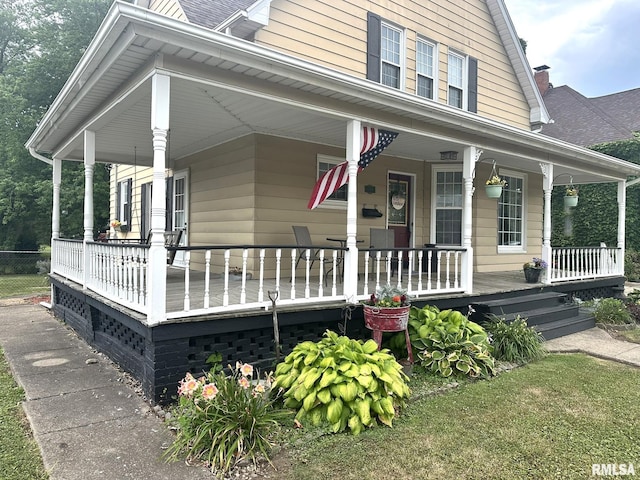 146 W Locust St, Canton, IL 61520 - view of front facade featuring a porch