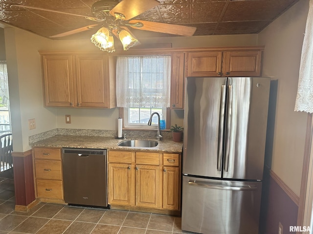 146 W Locust St, Canton, IL 61520 - kitchen with stainless steel appliances, a ceiling fan, light stone countertops, and dark tile patterned flooring