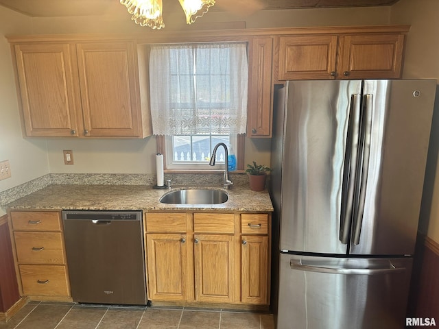 146 W Locust St, Canton, IL 61520 - kitchen with stainless steel appliances, light stone counters, and brown cabinets