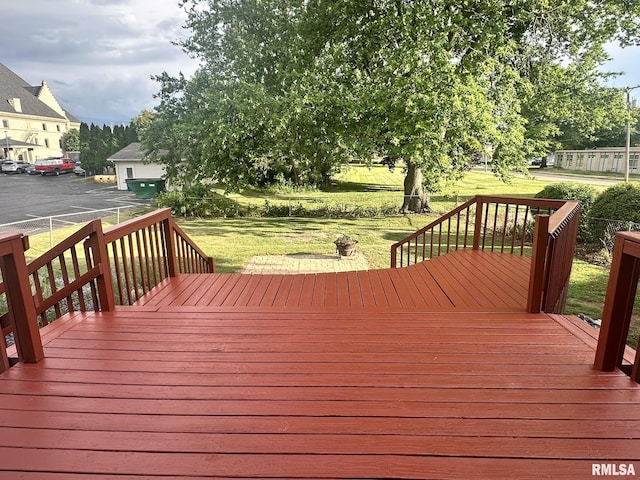 146 W Locust St, Canton, IL 61520 - wooden deck featuring a lawn
