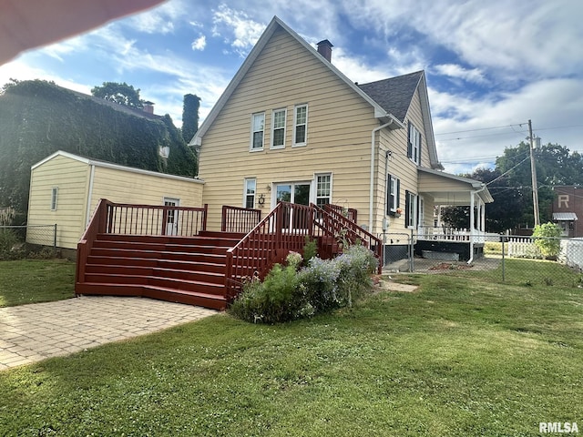 146 W Locust St, Canton, IL 61520 - back of house with stairs, a chimney, and a deck