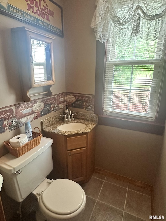 146 W Locust St, Canton, IL 61520 - bathroom featuring vanity and tile patterned floors