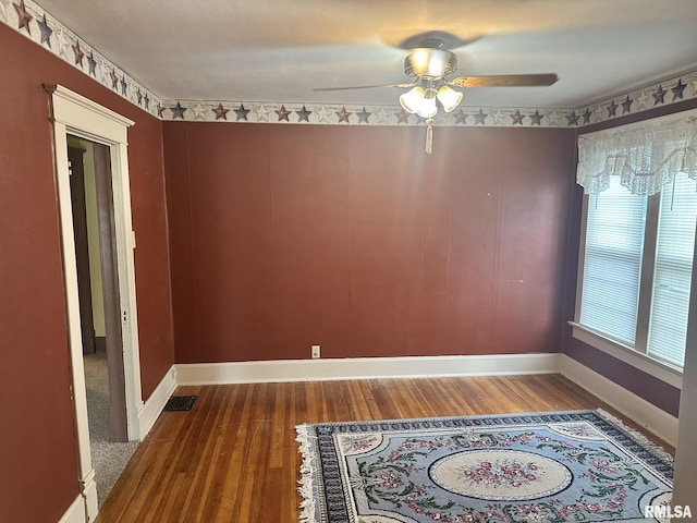 146 W Locust St, Canton, IL 61520 - empty room featuring wood finished floors and ceiling fan