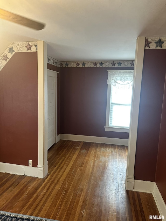 146 W Locust St, Canton, IL 61520 - empty room featuring hardwood / wood-style floors and baseboards