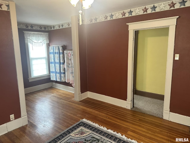 146 W Locust St, Canton, IL 61520 - spare room featuring baseboards and hardwood / wood-style flooring