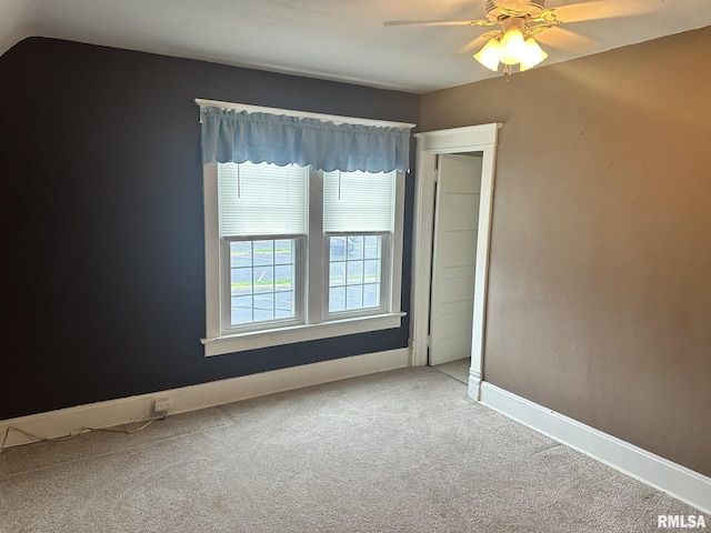 146 W Locust St, Canton, IL 61520 - unfurnished bedroom featuring carpet floors and a ceiling fan