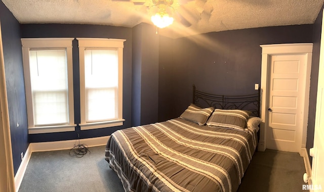 146 W Locust St, Canton, IL 61520 - carpeted bedroom with a textured ceiling and a ceiling fan