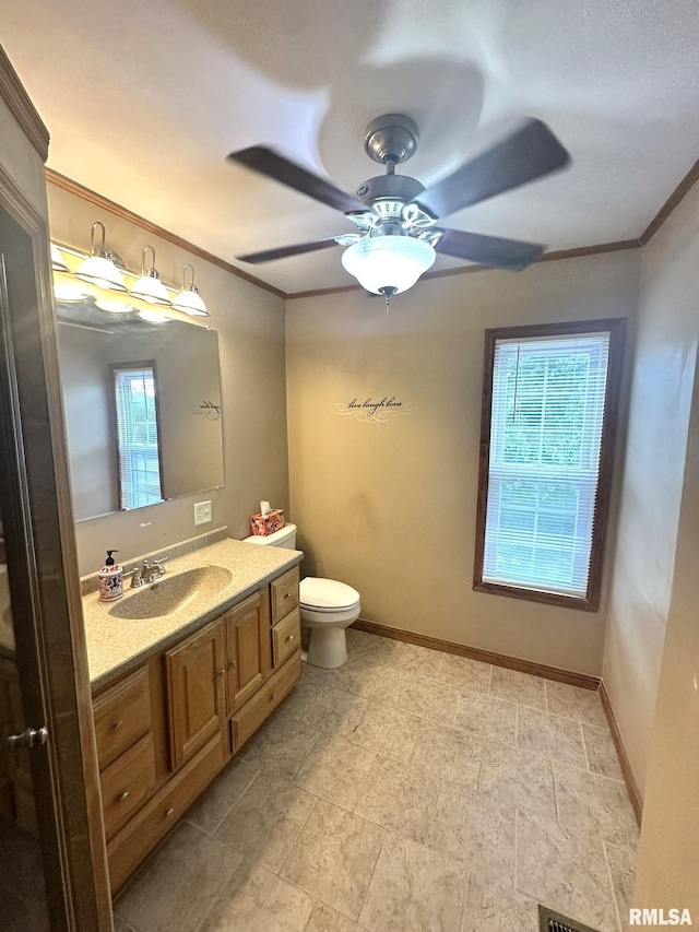 146 W Locust St, Canton, IL 61520 - bathroom featuring vanity, crown molding, and ceiling fan