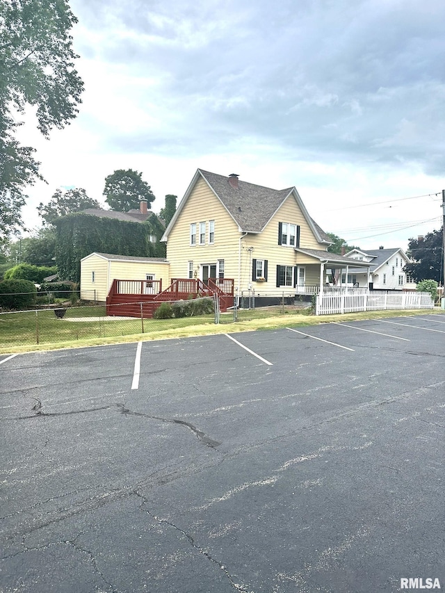 146 W Locust St, Canton, IL 61520 - view of building exterior with uncovered parking