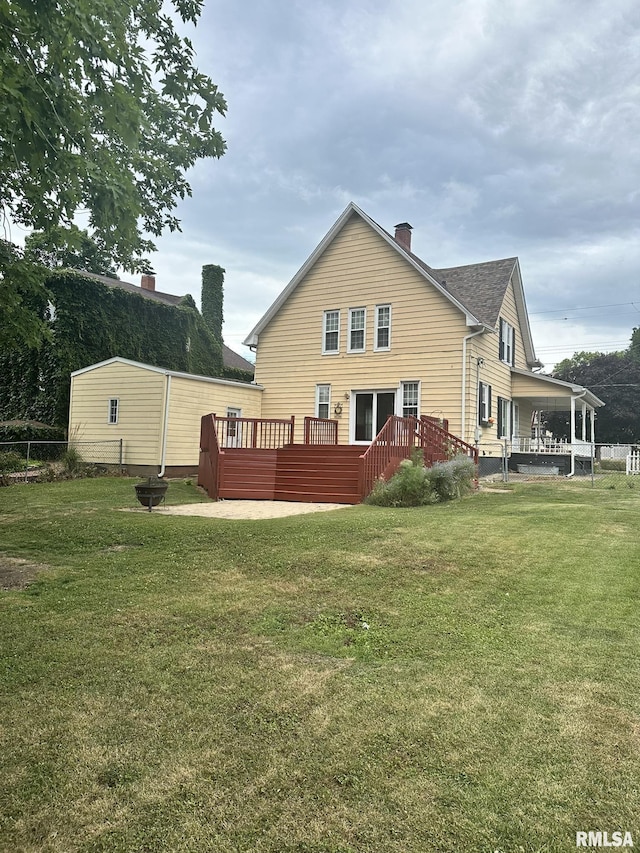 146 W Locust St, Canton, IL 61520 - back of property with a deck and a chimney