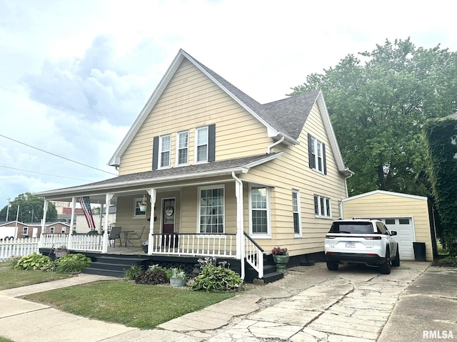 146 W Locust St, Canton, IL 61520 - view of front facade with a porch, an outdoor structure, a shingled roof, and a garage