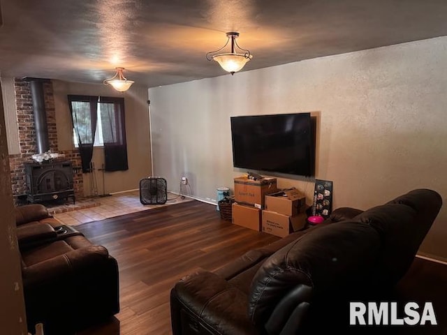 1415 E Sycamore St, Canton, IL 61520 - living area with a wood stove and wood finished floors
