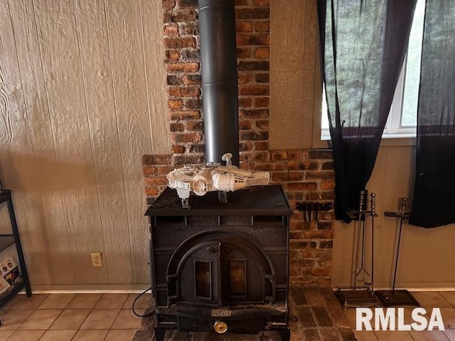 1415 E Sycamore St, Canton, IL 61520 - detailed view of a wood stove, wood walls, and brick wall