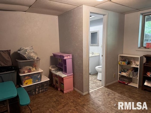 1415 E Sycamore St, Canton, IL 61520 - playroom with a paneled ceiling and a textured wall