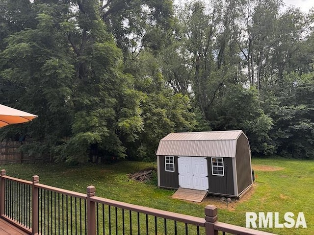 1415 E Sycamore St, Canton, IL 61520 - view of grassy yard featuring a storage shed and a deck